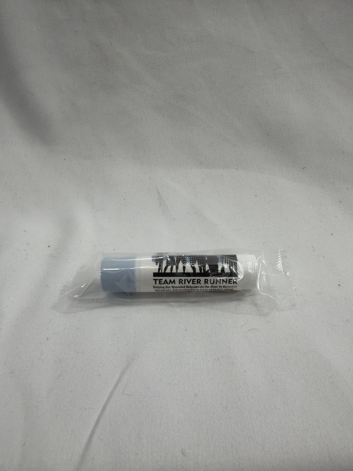 Vanilla chapstick with blue lid